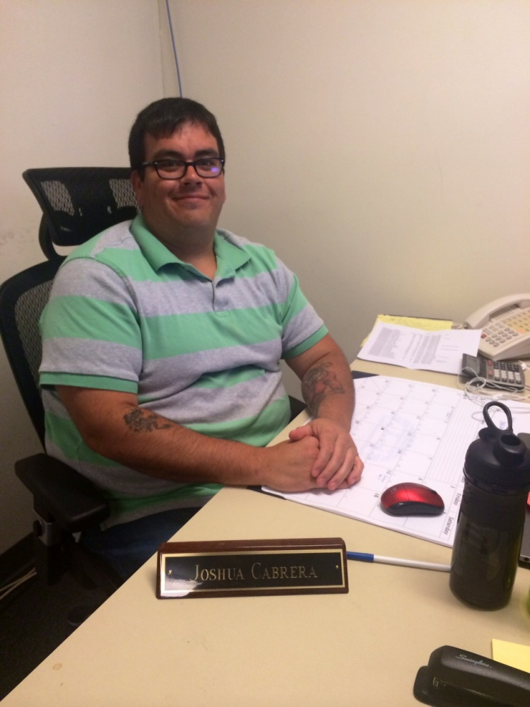 Joshua Cabrera sitting at a desk