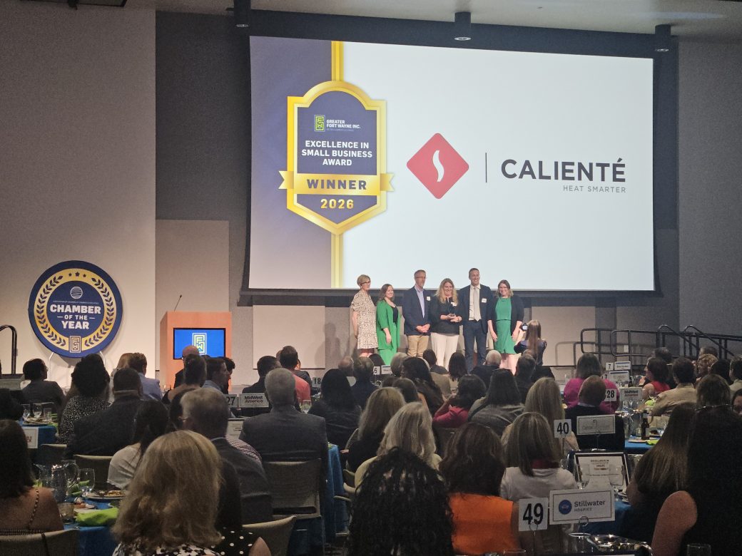 business people collecting award on stage
